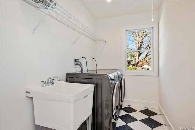 80 Ocean Ave, Massapequa, NY 11758 - clothes washing area with tile patterned floors, a sink, baseboards, independent washer and dryer, and laundry area