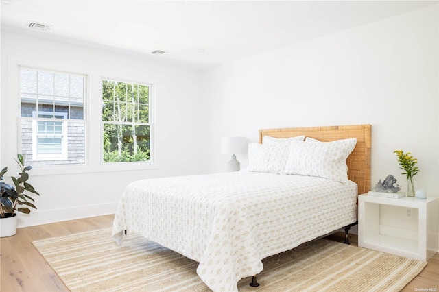 bedroom featuring wood-type flooring