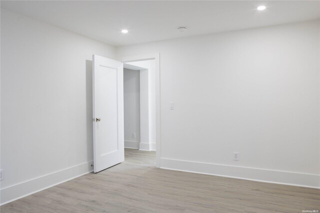 spare room with light hardwood / wood-style floors