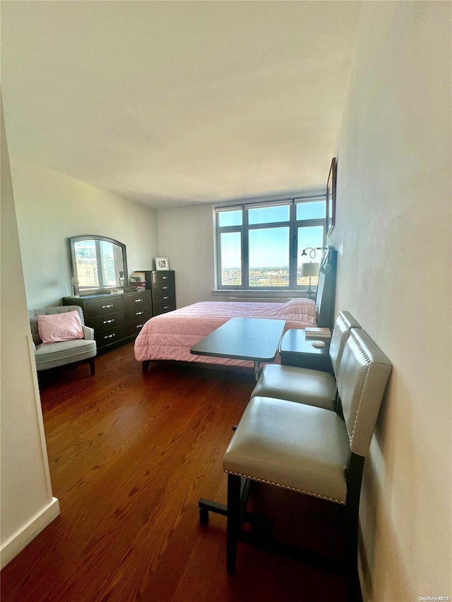 bedroom featuring dark hardwood / wood-style flooring