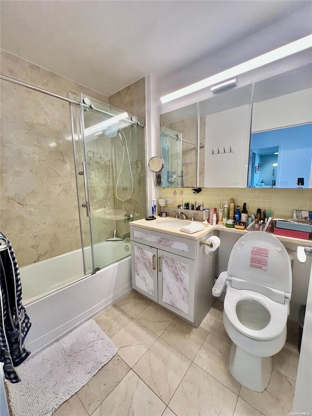 full bathroom featuring vanity, toilet, enclosed tub / shower combo, and tasteful backsplash