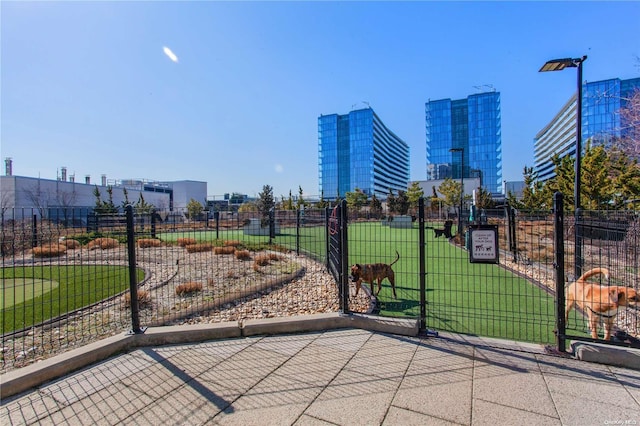 view of property's community with a lawn