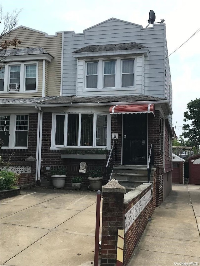 view of front of home featuring cooling unit