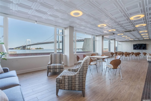 166-25 Powells Cove Blvd Unit 21G, Beechhurst, NY 11357 - living area with wood finished floors, a water view, baseboards, and an ornate ceiling