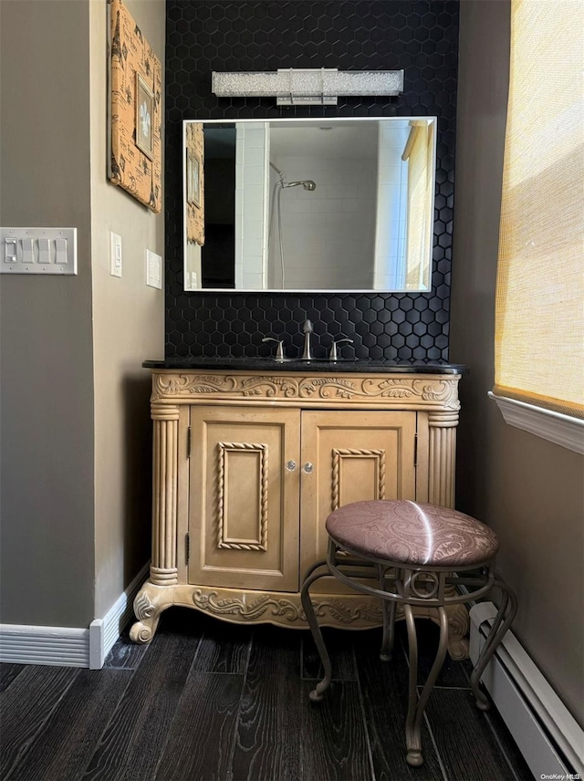 bathroom with vanity and a baseboard heating unit