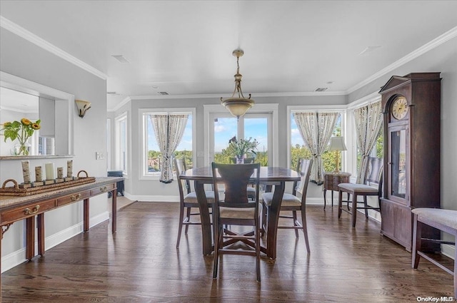 dining area with dark hardwood / wood-style floors and ornamental molding