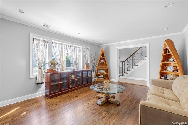 living room featuring crown molding and hardwood / wood-style flooring