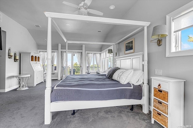 bedroom with vaulted ceiling, multiple windows, and ceiling fan