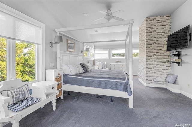 bedroom featuring ceiling fan and dark carpet