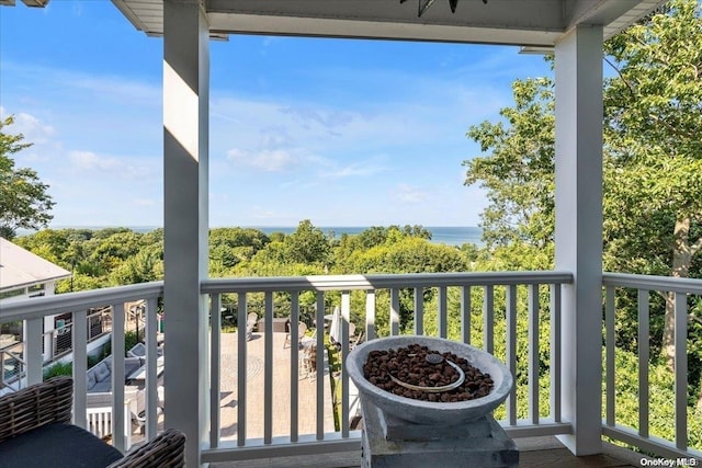 balcony featuring a water view