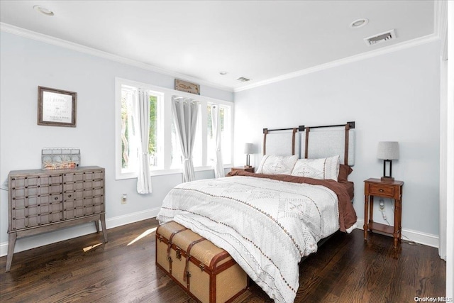 bedroom with dark hardwood / wood-style floors and crown molding