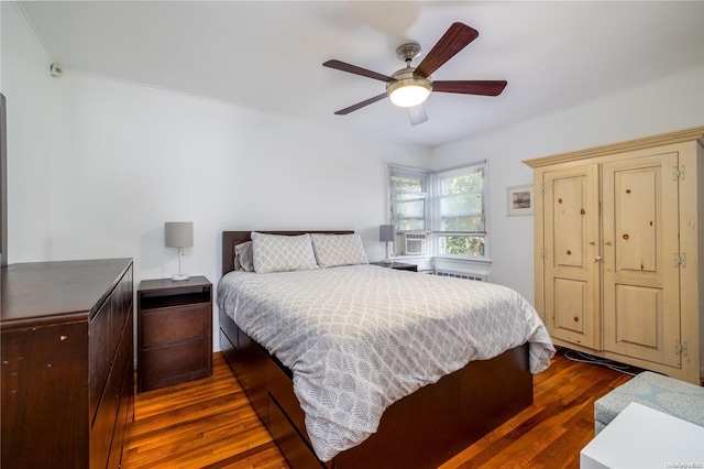 bedroom featuring ceiling fan and dark hardwood / wood-style flooring