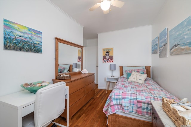 bedroom featuring ceiling fan, dark hardwood / wood-style floors, and ornamental molding