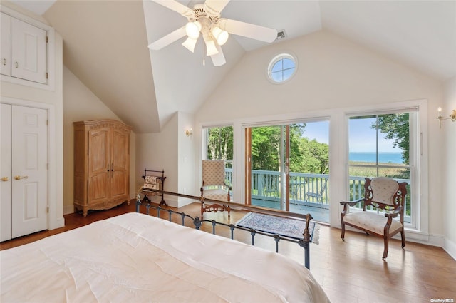 156 Ram Island Dr, Shelter Island, NY 11964 - bedroom featuring access to exterior, multiple windows, vaulted ceiling, and a water view