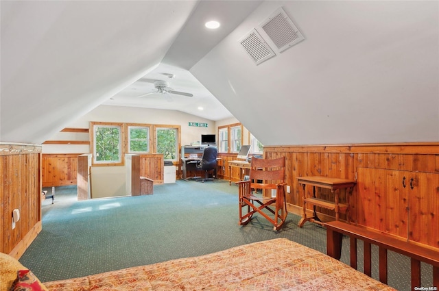 156 Ram Island Dr, Shelter Island, NY 11964 - bedroom with a desk, carpet floors, vaulted ceiling, wood walls, and a wainscoted wall