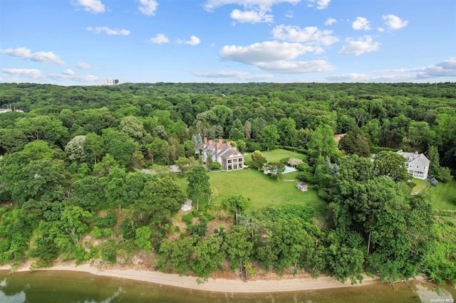 aerial view featuring a water view and a forest view