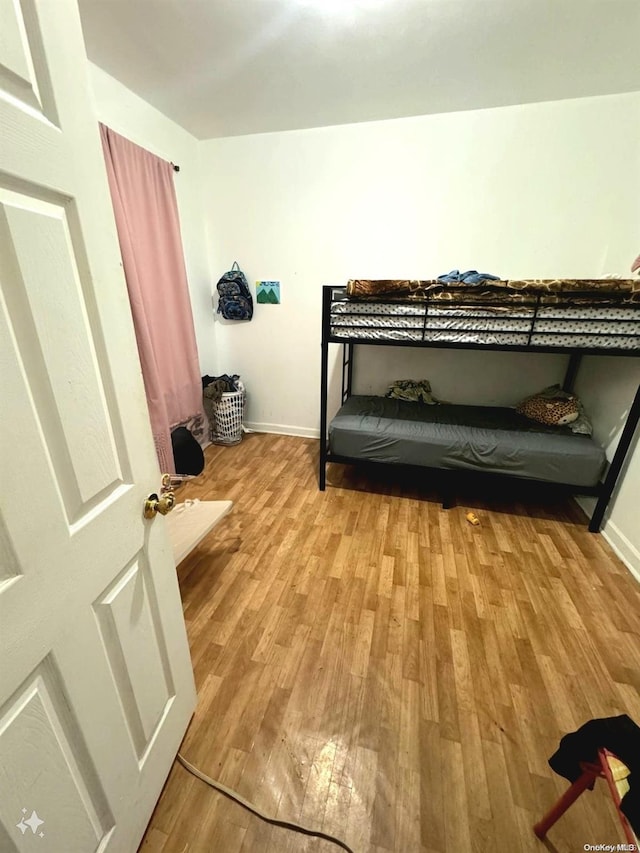 bedroom with light hardwood / wood-style floors