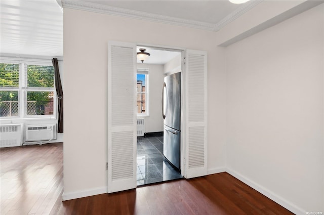 corridor featuring radiator heating unit, dark hardwood / wood-style flooring, cooling unit, and ornamental molding