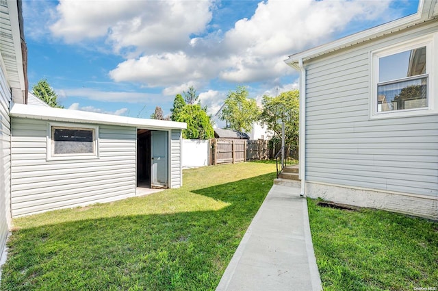 view of yard with a storage unit