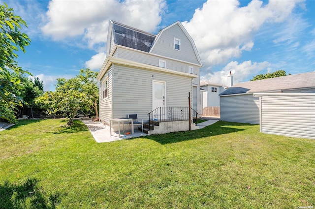 rear view of house with a lawn