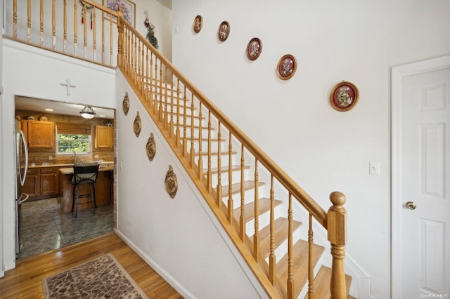 stairway featuring hardwood / wood-style floors