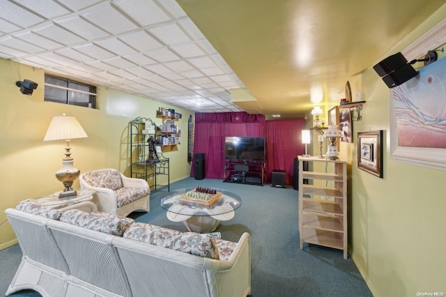 carpeted living room featuring a paneled ceiling