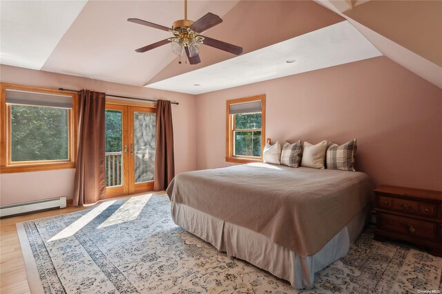 bedroom with ceiling fan, a baseboard radiator, lofted ceiling, access to outside, and hardwood / wood-style flooring