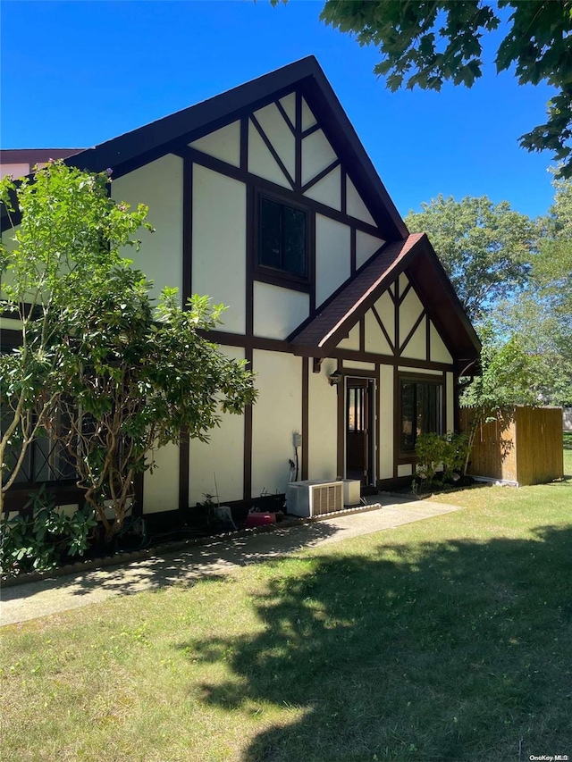 rear view of house with a yard