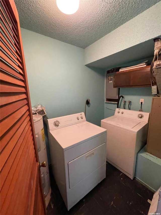 laundry area with electric water heater, independent washer and dryer, and a textured ceiling