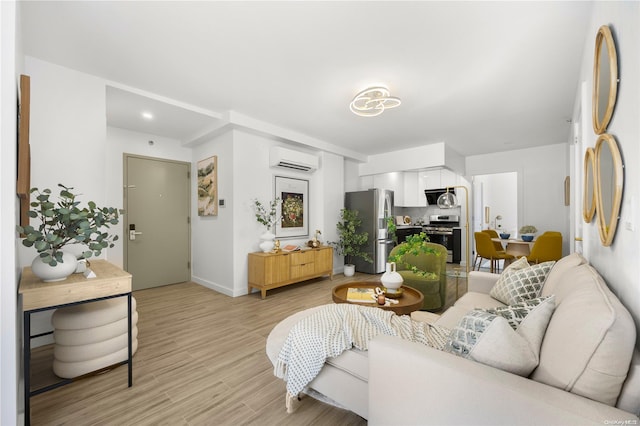 living room with light wood-type flooring and an AC wall unit