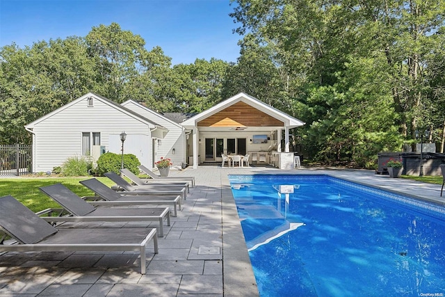 view of swimming pool featuring a patio area