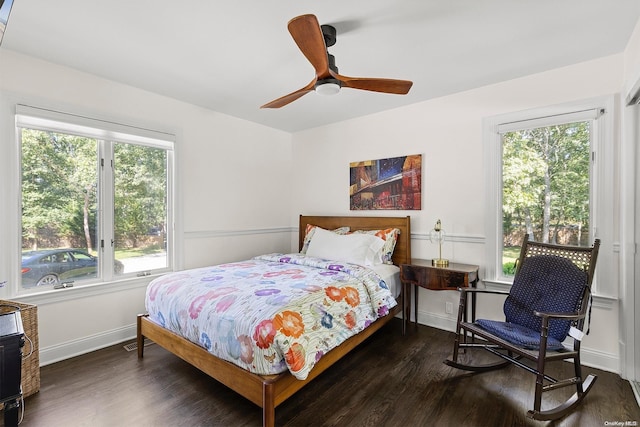 bedroom featuring ceiling fan and dark hardwood / wood-style flooring