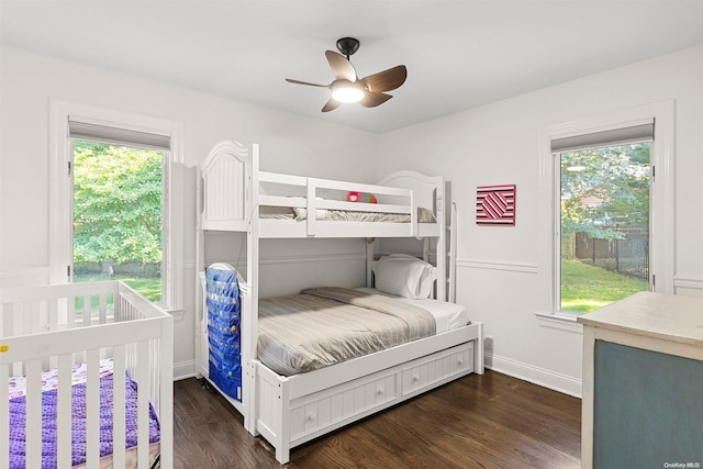 bedroom featuring ceiling fan and dark hardwood / wood-style floors