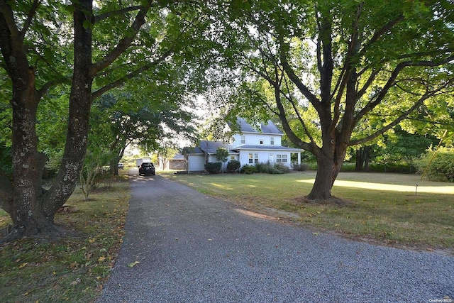 view of front facade with a garage and a front yard