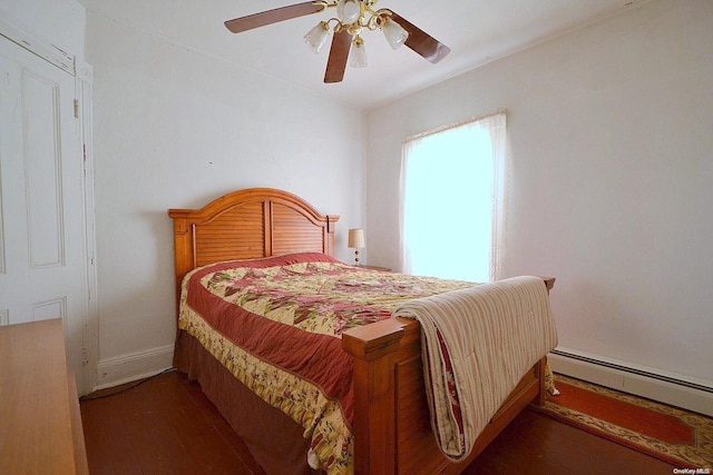 bedroom with a baseboard radiator, ceiling fan, and dark wood-type flooring