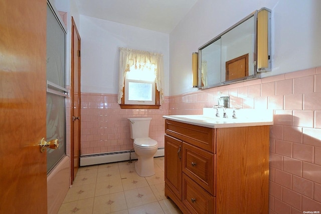 full bathroom featuring baseboard heating, combined bath / shower with glass door, toilet, vanity, and tile walls