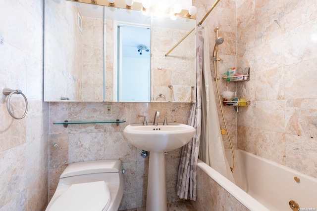 full bathroom featuring sink, toilet, tile walls, and shower / tub combo with curtain