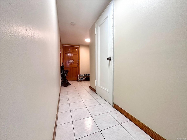 corridor with light tile patterned flooring