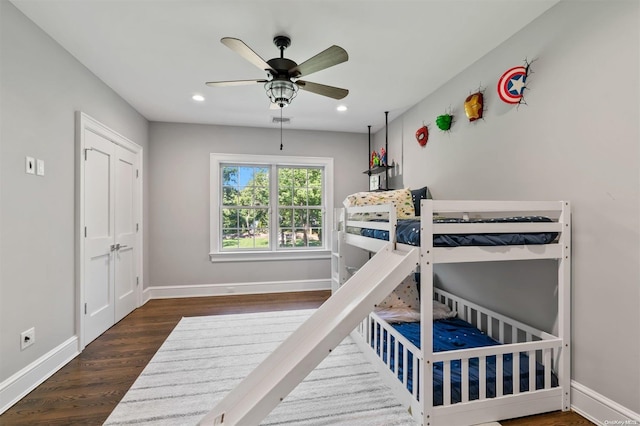 bedroom featuring dark hardwood / wood-style floors and ceiling fan