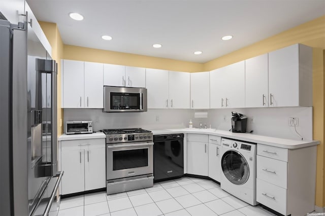 215 Middle Neck Rd Unit 16-1A, Great Neck, NY 11021 - kitchen featuring washer / clothes dryer, sink, white cabinets, and appliances with stainless steel finishes
