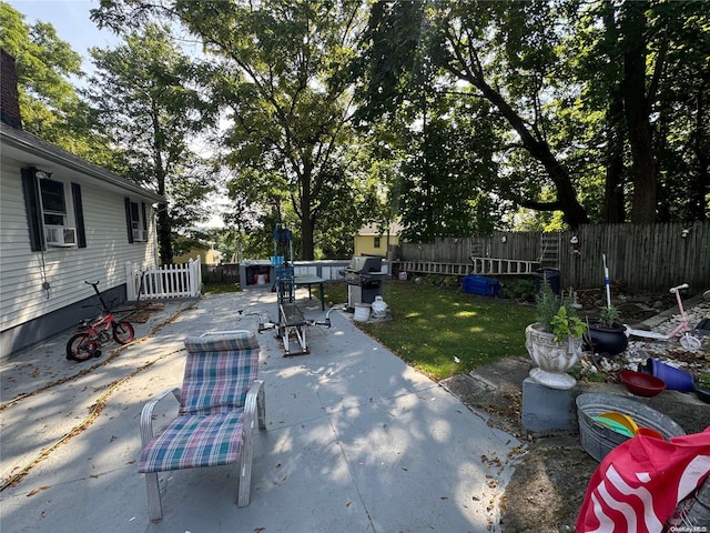 view of patio featuring area for grilling and cooling unit