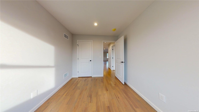 hall with light hardwood / wood-style flooring