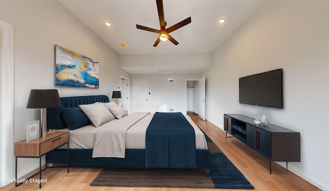 bedroom with ceiling fan and light wood-type flooring