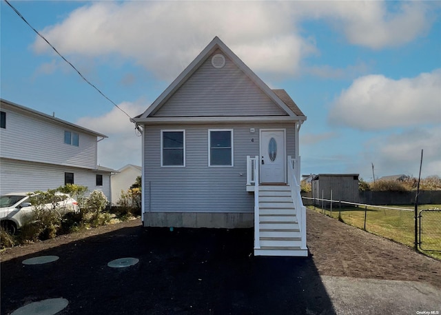 view of front of house with fence