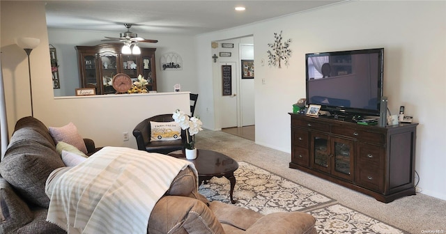 living room featuring ceiling fan and light carpet