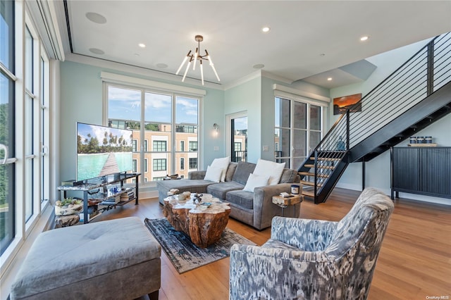100 Garvies Point Rd Unit 1309, Glen Cove, NY 11542 - living room featuring stairway, a chandelier, crown molding, wood finished floors, and recessed lighting