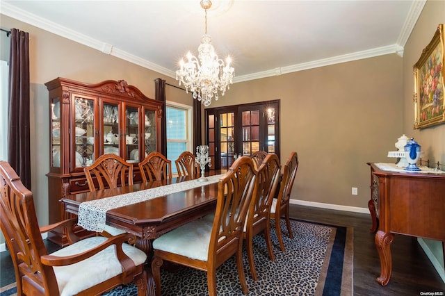 dining space with a notable chandelier, dark hardwood / wood-style floors, and ornamental molding
