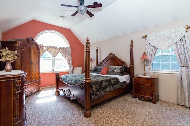 carpeted bedroom with ceiling fan and lofted ceiling