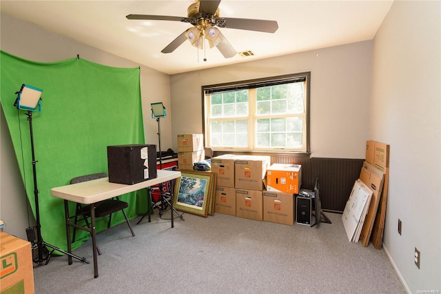 office featuring ceiling fan and light carpet
