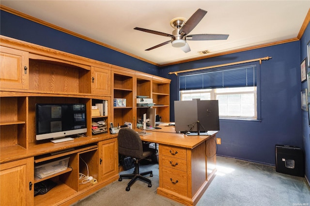 carpeted home office featuring ceiling fan and ornamental molding